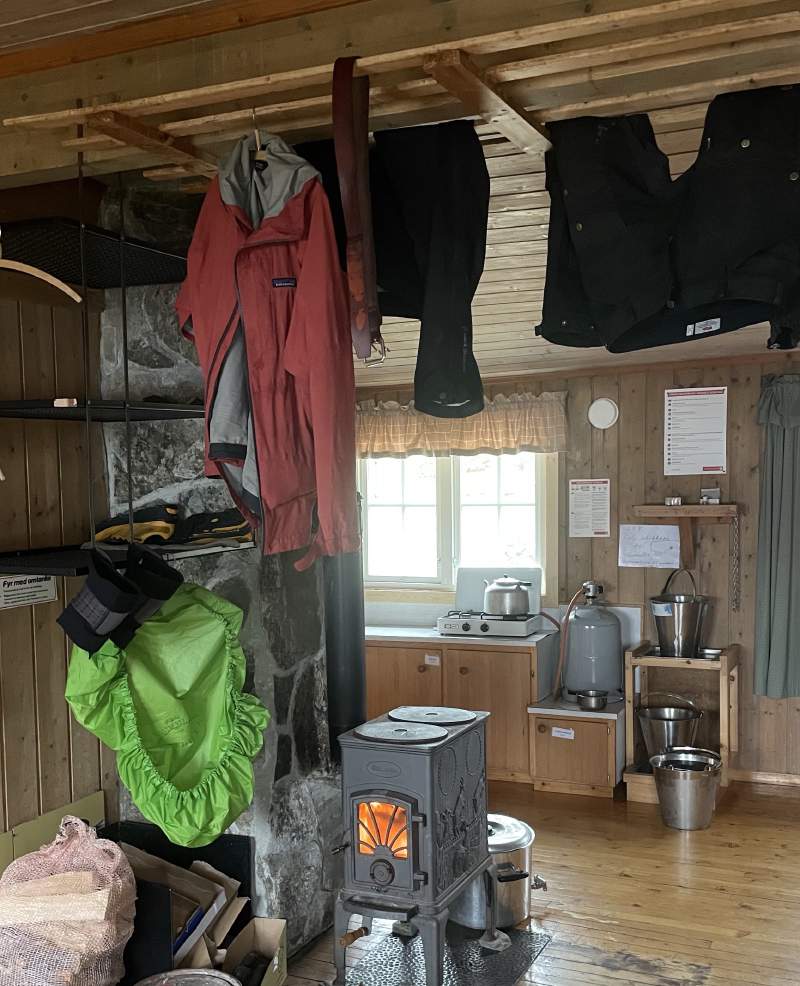 Cabin routine: Drying gear and clothes by the fire