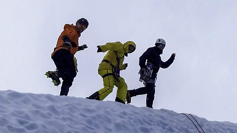 Posing on a glacier serac: sweat is inevitable, stink doesn&amp;rsquo;t have to be! (Author in the orange jacket.)