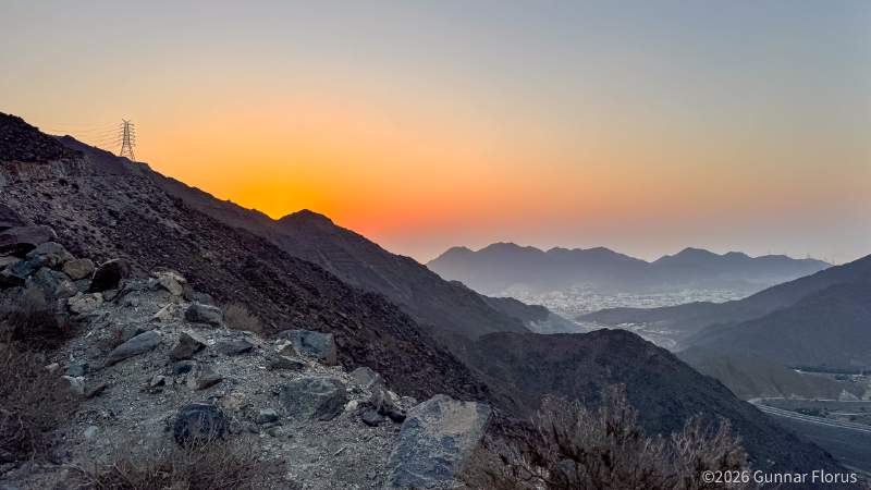 Roughly halfway up, with Khor Fakkan in the background