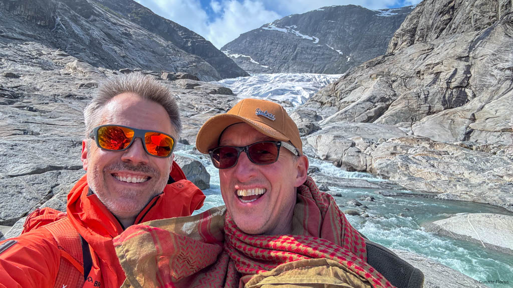 The author and Tim Searle enjoying a moment at the foot of Nigardsbreen, Jostedal Glacier, Norway Photo: © 2024 Gunnar Florus